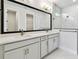 Bright bathroom with double sink vanity, marble floors, and walk-in shower at 11834 Mile Marsh Dr, Riverview, FL 33569