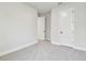 Spacious bedroom featuring neutral carpet, doors, and ample natural light at 11834 Mile Marsh Dr, Riverview, FL 33569