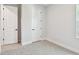 Cozy bedroom with neutral carpet, base molding, window and white doors at 11834 Mile Marsh Dr, Riverview, FL 33569
