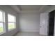 Bright bedroom features tray ceiling, neutral carpet and two windows providing lots of natural light at 11834 Mile Marsh Dr, Riverview, FL 33569