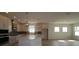 Open kitchen boasts modern white cabinets, a large island, and stainless steel appliances at 11834 Mile Marsh Dr, Riverview, FL 33569