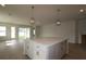 Gourmet kitchen features a large center island with pendant lights at 11834 Mile Marsh Dr, Riverview, FL 33569