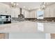 Well-equipped kitchen featuring stainless steel appliances, tile backsplash, and a quartz countertop island at 11834 Mile Marsh Dr, Riverview, FL 33569