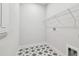 Clean laundry room with a patterned floor, wire shelving, and ample space at 11834 Mile Marsh Dr, Riverview, FL 33569