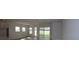 Open living space with plenty of natural light and sliding glass door leading to back yard at 11834 Mile Marsh Dr, Riverview, FL 33569
