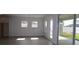 Bright living room with sliding glass doors leading to an outdoor patio and backyard at 11834 Mile Marsh Dr, Riverview, FL 33569