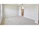 Neutral bedroom with carpet and tray ceiling has ensuite bathroom at 11834 Mile Marsh Dr, Riverview, FL 33569