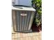 Energy-efficient Lennox air conditioner unit surrounded by well-maintained landscaping and brick pavers at 1201 Ventana Dr, Sun City Center, FL 33573