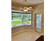 Cozy dining nook with a large window offering serene views and a glass-paneled door at 1201 Ventana Dr, Sun City Center, FL 33573