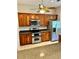 Kitchen featuring stainless steel appliances and wooden cabinetry at 1201 Ventana Dr, Sun City Center, FL 33573