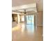 Bright and airy living room with tile flooring, a modern ceiling fan, and sliding doors to the lanai at 1201 Ventana Dr, Sun City Center, FL 33573