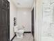 Bathroom showcasing hexagon tile floors, a white toilet, and modern fixtures at 1221 E Emma St, Tampa, FL 33603
