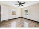Comfortable bedroom featuring wood laminate flooring and a neutral color scheme at 1221 E Emma St, Tampa, FL 33603