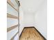 Hallway with laminate flooring, a sliding glass door, and neutral white paint at 1221 E Emma St, Tampa, FL 33603