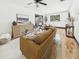 Bright living room with hardwood floors, stylish furniture, and a decorative area rug at 1221 E Emma St, Tampa, FL 33603