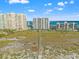 Stunning aerial shot of beach condos, showcasing the boardwalk over dunes leading to a pristine beach, with beautiful water views at 1230 Gulf Blvd # 508, Clearwater Beach, FL 33767