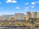 Breathtaking aerial view showcases the coastal community and its pristine beach set against a brilliant blue sky at 1230 Gulf Blvd # 508, Clearwater Beach, FL 33767