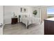 Comfortable bedroom featuring modern decor, a balcony, and neutral color schemes at 1230 Gulf Blvd # 508, Clearwater Beach, FL 33767