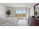 Bright bedroom featuring a balcony overlooking the ocean, neutral tones and natural light at 1230 Gulf Blvd # 508, Clearwater Beach, FL 33767