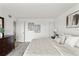 Comfortable bedroom featuring light gray color schemes, a dresser, and modern art at 1230 Gulf Blvd # 508, Clearwater Beach, FL 33767