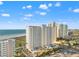 Elevated view of high-rise beachfront condos under a bright blue sky at 1230 Gulf Blvd # 508, Clearwater Beach, FL 33767