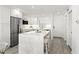 Stylish white kitchen featuring quartz countertops, stainless steel appliances, and a functional island at 1230 Gulf Blvd # 508, Clearwater Beach, FL 33767