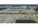 Picture of lake community neighborhood with an arrow pointing to the home at 13234 Great Plains Dr, Riverview, FL 33579