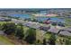 Aerial view of backyard with playground, and community pond in the distance at 13234 Great Plains Dr, Riverview, FL 33579