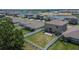 View of fenced in backyard with patio, playground and green grass at 13234 Great Plains Dr, Riverview, FL 33579