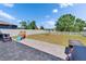 Spacious backyard with well-maintained grass, swing set and slide, perfect for outdoor activities at 13234 Great Plains Dr, Riverview, FL 33579