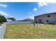 Large backyard with a swing set and a fence for privacy, with plenty of room to play at 13234 Great Plains Dr, Riverview, FL 33579