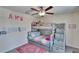 Cozy bedroom featuring bunkbeds, built-in storage, and a ceiling fan at 13234 Great Plains Dr, Riverview, FL 33579