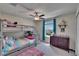 Inviting bedroom with bunkbeds, dresser, and a ceiling fan at 13234 Great Plains Dr, Riverview, FL 33579