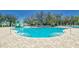 Fun community pool featuring a splash zone, comfortable lounge chairs, and a kid-friendly play area at 13234 Great Plains Dr, Riverview, FL 33579