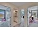 Hallway view showcases doorways to bedrooms and bathroom at 13234 Great Plains Dr, Riverview, FL 33579