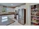 Well-equipped kitchen with white cabinetry, stainless steel appliances, granite countertops, and a convenient pantry at 13234 Great Plains Dr, Riverview, FL 33579