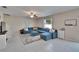 Bright living room area with contemporary furnishings and staircase access at 13234 Great Plains Dr, Riverview, FL 33579