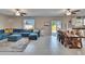 Open living space flows into the dining area, complete with a large sectional at 13234 Great Plains Dr, Riverview, FL 33579