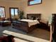 Sunlit main bedroom with neutral color palette, complemented by large windows at 1516 Bayshore Blvd, Dunedin, FL 34698