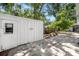 Backyard with a shed, a patio, and mature trees at 1557 Robinson N Dr, St Petersburg, FL 33710