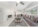 Spacious finished basement with a fireplace, comfortable seating, and ample lighting at 1557 Robinson N Dr, St Petersburg, FL 33710