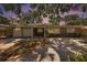 Well-maintained ranch-style home with stone facade and mature landscaping at 1557 Robinson N Dr, St Petersburg, FL 33710