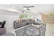 Modern living room featuring white walls, a decorative rug, modern furniture, and natural light at 1557 Robinson N Dr, St Petersburg, FL 33710