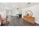 Spacious main bedroom features hardwood floors, ceiling fan, natural light, and ample space at 1557 Robinson N Dr, St Petersburg, FL 33710