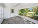 Cozy screened porch offers natural light and access to the backyard at 1557 Robinson N Dr, St Petersburg, FL 33710