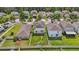 Well-maintained backyard, with a fenced in yard, and solar panels at 17331 White Mangrove Dr, Wimauma, FL 33598