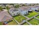 Fenced backyard featuring a green lawn, offering privacy and space for outdoor activities at 17331 White Mangrove Dr, Wimauma, FL 33598