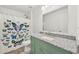 Updated bathroom features a shower with butterfly curtain, granite countertops and modern fixtures at 17331 White Mangrove Dr, Wimauma, FL 33598