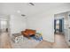 Bonus room featuring a small sofa, accent rug, table, and access to another room at 17331 White Mangrove Dr, Wimauma, FL 33598