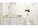 Bright bathroom featuring a granite countertop vanity and modern fixtures at 17611 Happytrails St, Land O Lakes, FL 34638